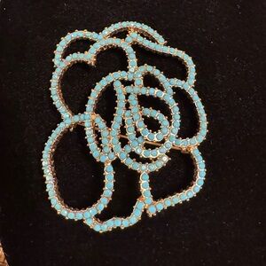 Large floral faux turquoise on gold tone brooch